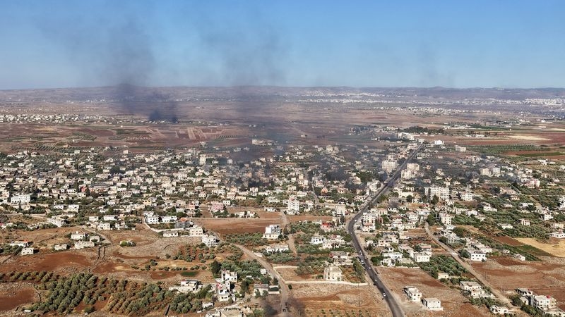 How Syrian attackers killed: One hand on the gun, another on the camera