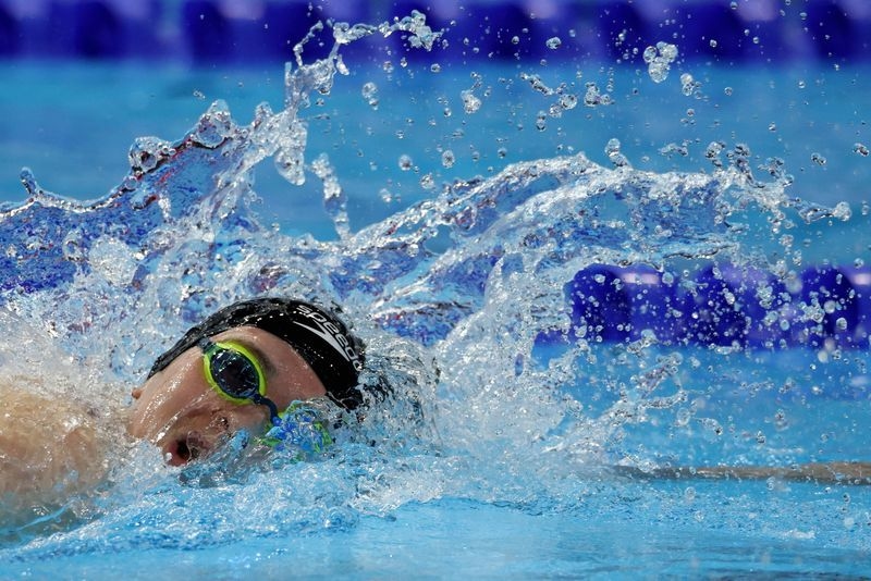 Swimming-Fairweather shrugs off 400 freestyle DQ to top 200 heats