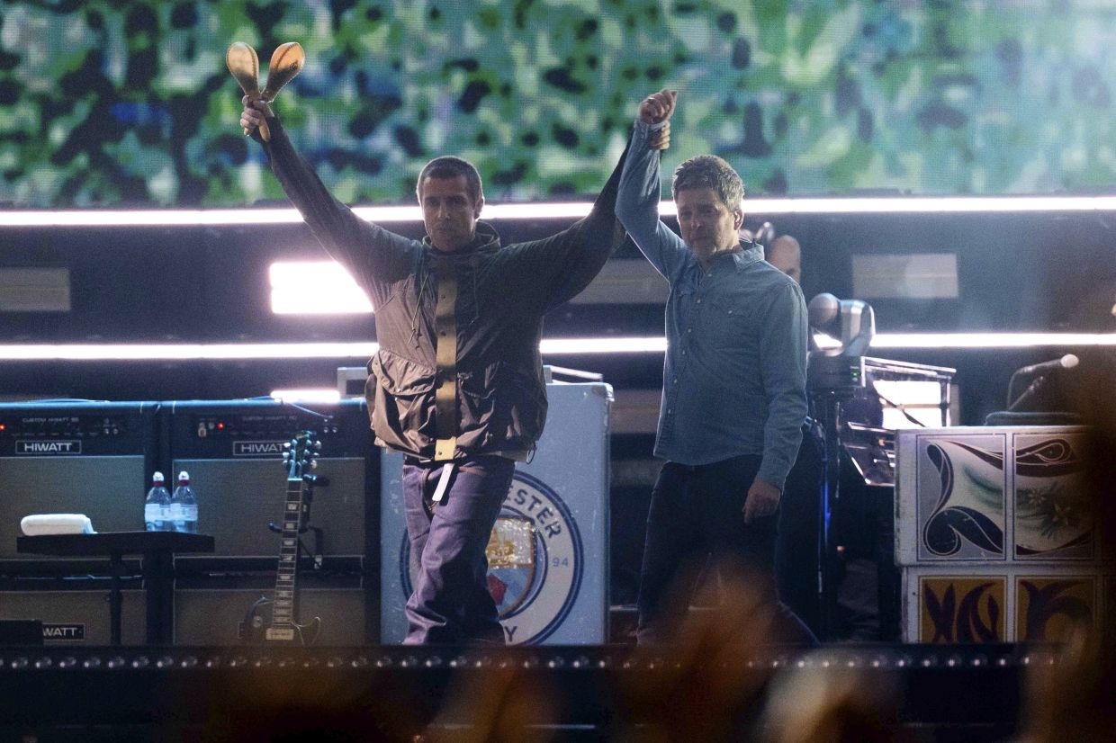 Oasis 'shocked and saddened' after fan falls to his death at show