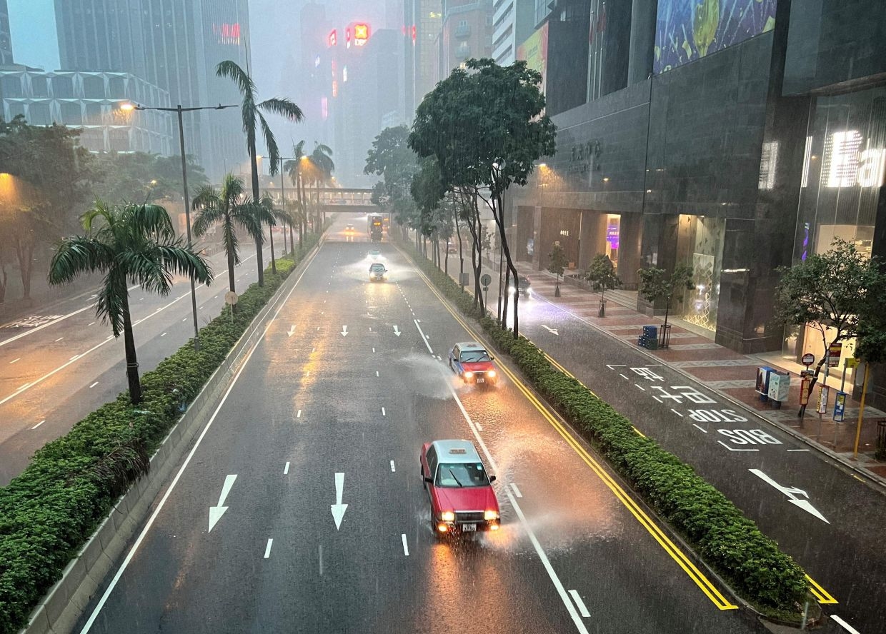 Hong Kong issues highest weather warning, as rains shut schools, courts and hospital wards