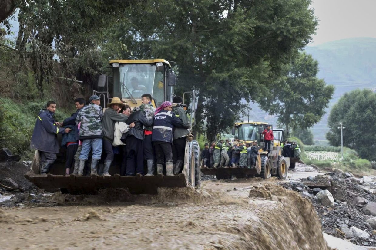 Death toll from northwest China floods rises to 13
