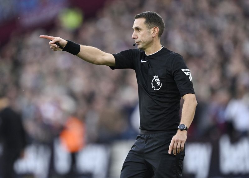 Soccer-FA imposes eight-week ban on former referee Coote for Klopp comments