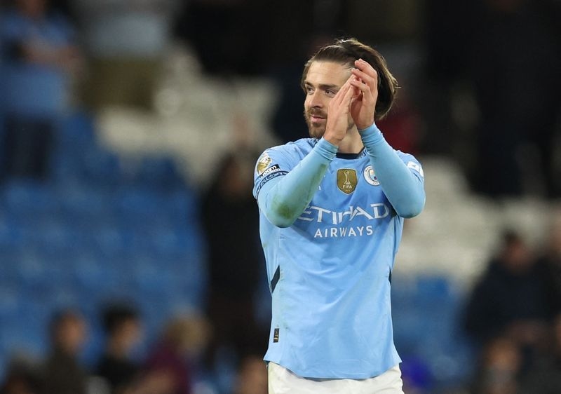 Soccer-Everton sign Grealish on season-long loan