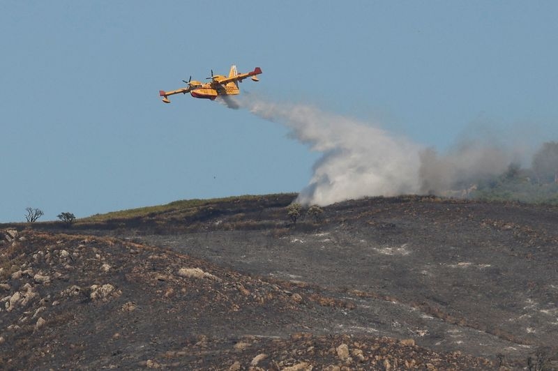 Volunteer firefighter dies as wildfires rage across heat-stricken Spain