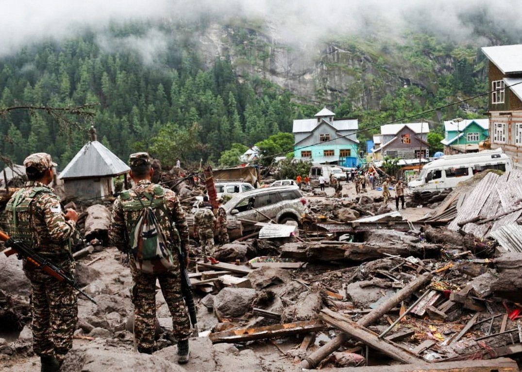 Indian rescuers scour debris after 60 killed in flood, and scores of people are also missing