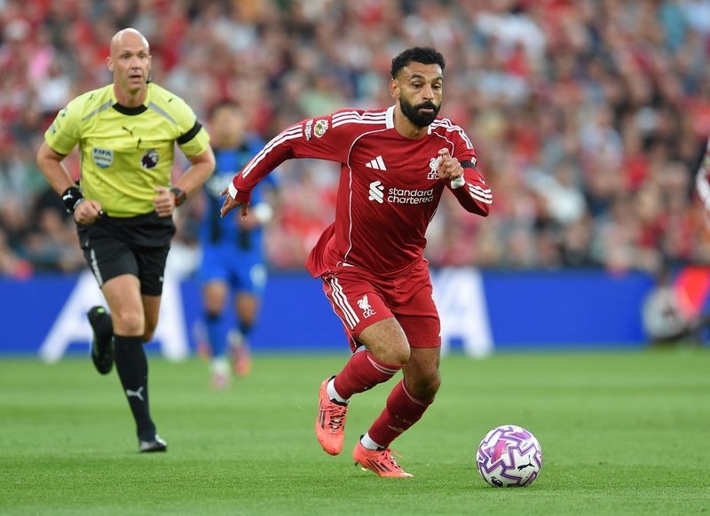 Soccer-Late Salah, Chiesa goals give Liverpool 4-2 win in thrilling opener