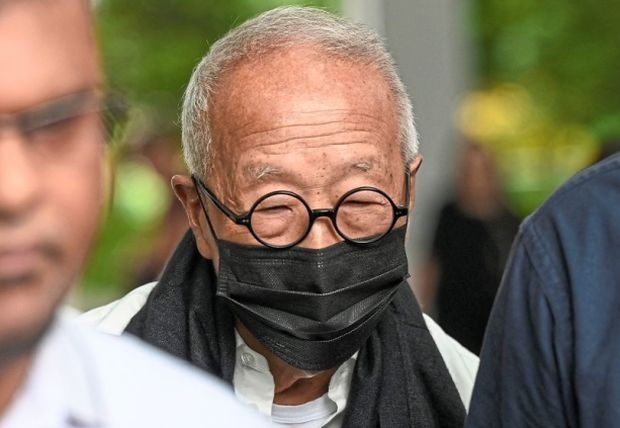 Tycoon spared jail in ex-minister case, fined S$30k