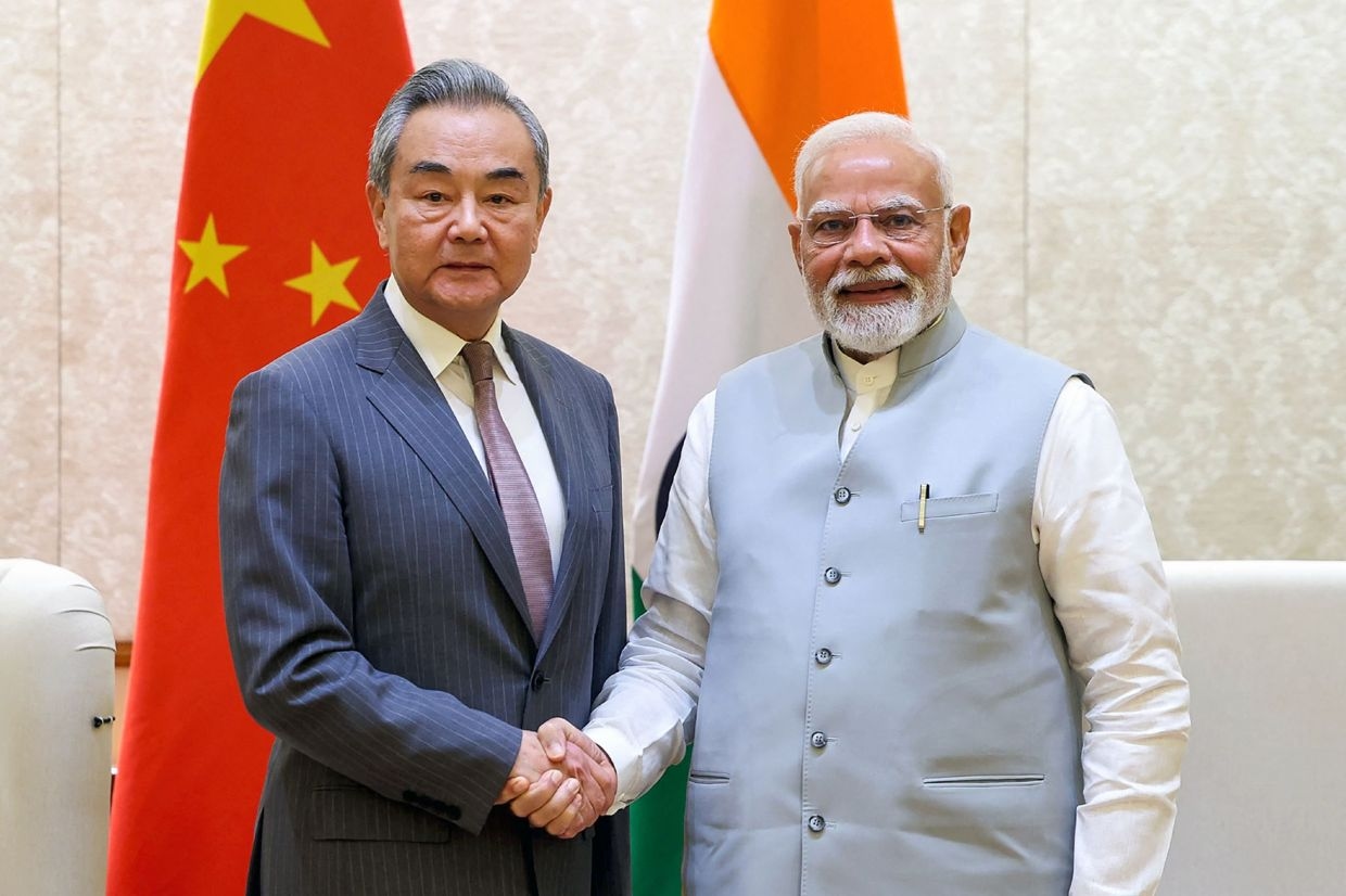China, India pledge to resume flights as Beijing's top diplomat wraps up visit