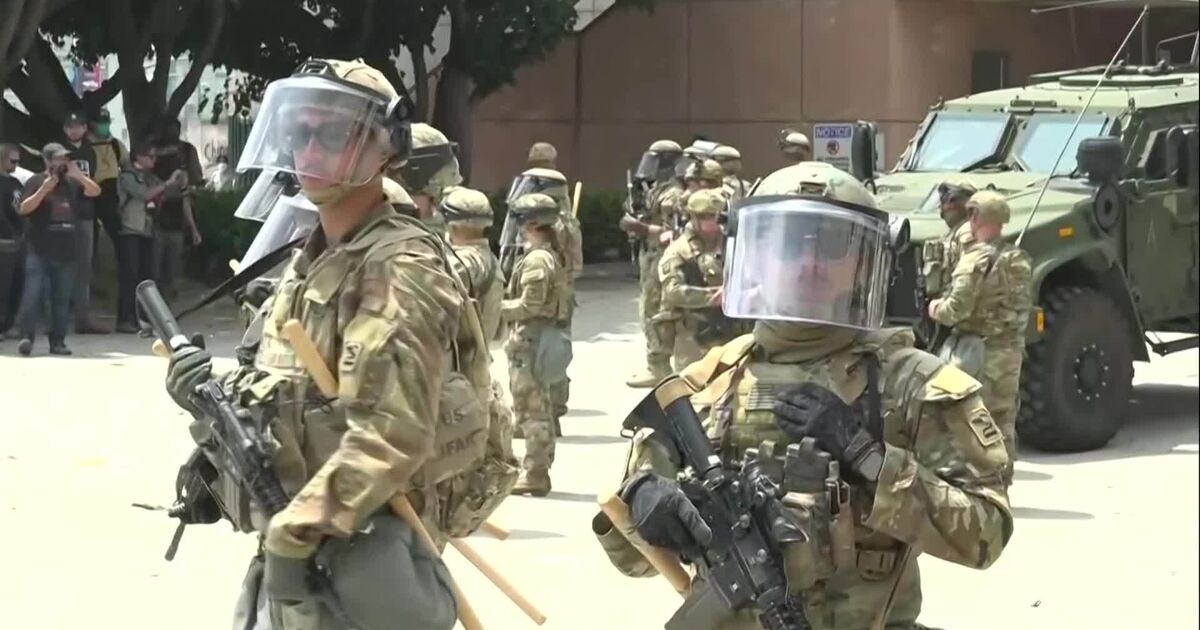 National Guard Troops Line up in Front of LA Protestors