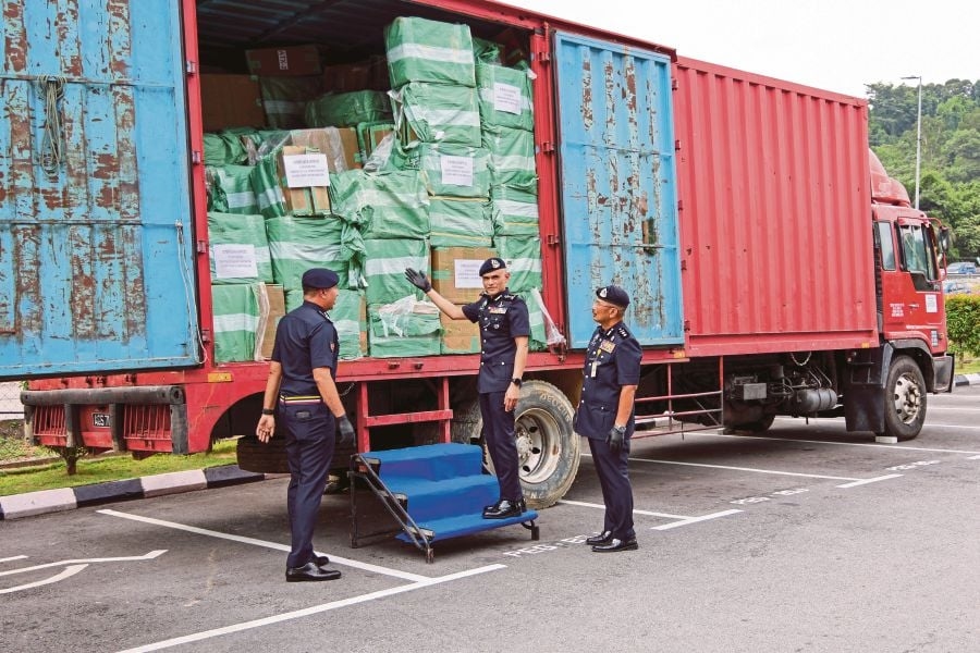 Two charged over RM13.45mil untaxed cigarettes seized in Sepang