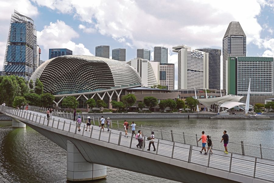 Singapore hits record high for 14th session, sets the pace for Asian equities