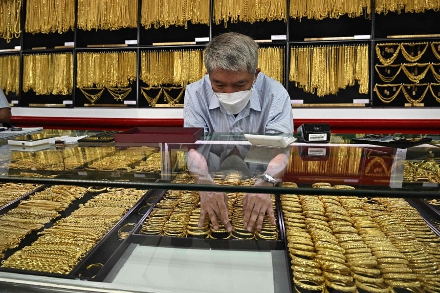 Gold little changed as traders await US inflation data