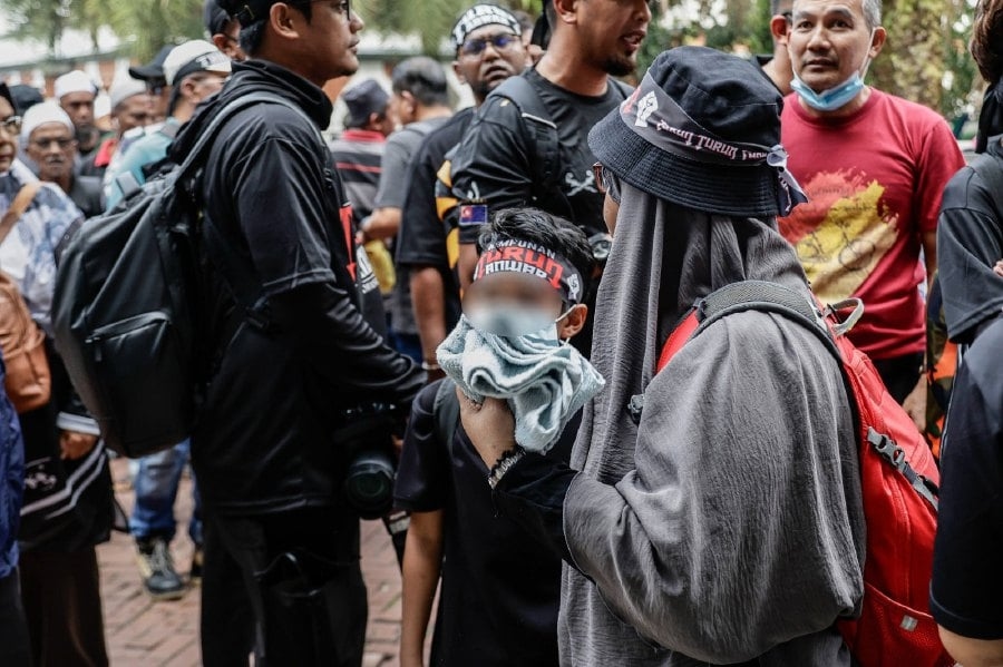 Parents seen bringing young children to opposition rally at Dataran Merdeka