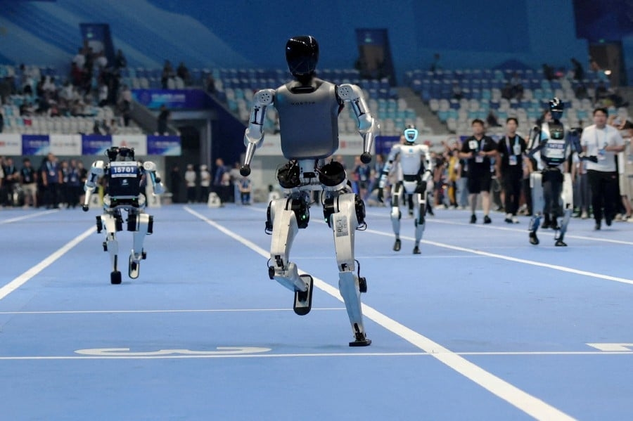 China's 'robot Olympics' sees humanoids from 16 nations compete in table tennis, football, track