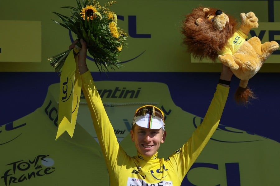 Leader Pogacar keeps ear on partner's progress in middle of Tour stage
