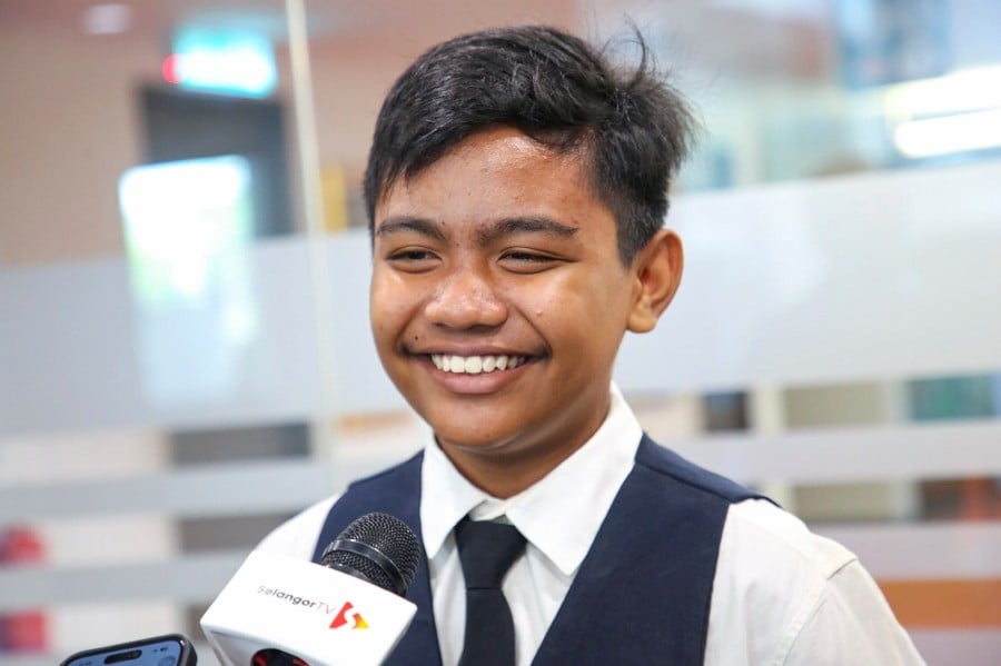 Food delivery worker's son tops Selangor's library charts with 1,378 books borrowed