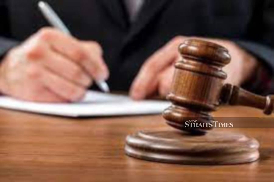 Lorry driver charged with driving under the influence and causing motorcyclist's death