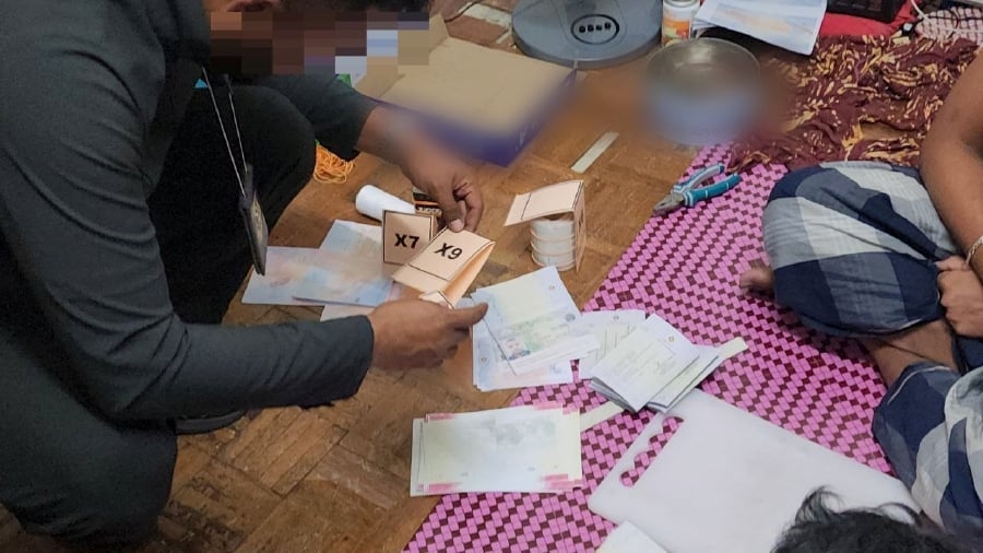 Immigration busts fake passport factory in Kepong