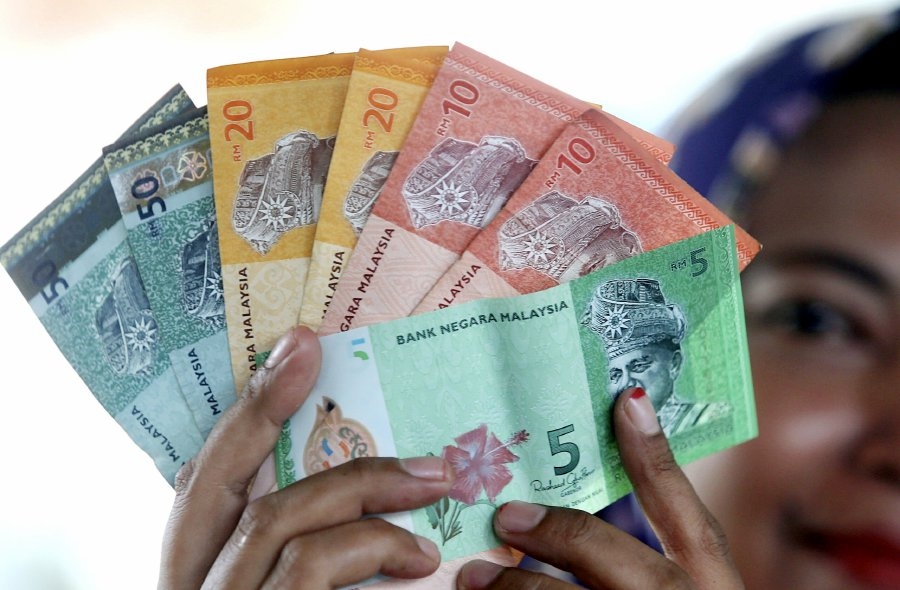 Ringgit eases against greenback on profit-taking after recent gains