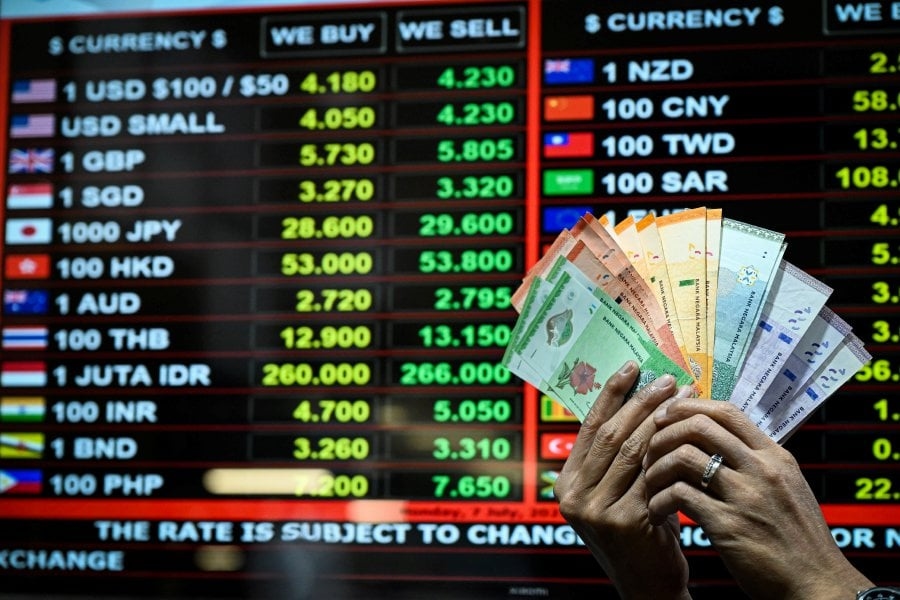 Ringgit opens lower versus greenback