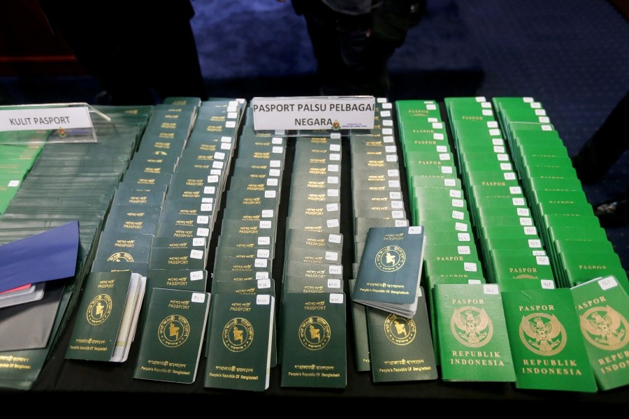 Forgers earn millions from fake passports, work passes