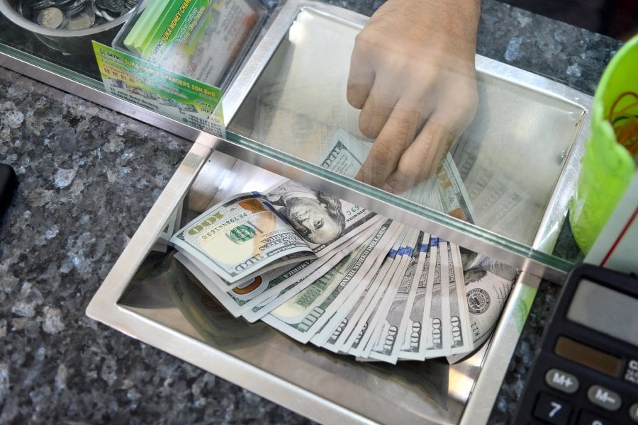 Dollar steady as traders await details from US-China talks