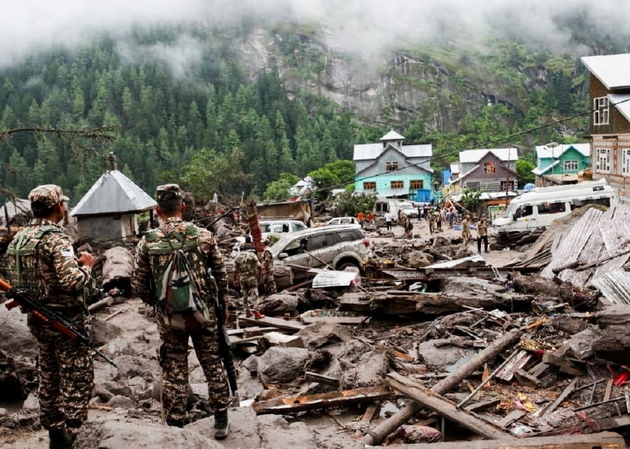 Indian rescuers scour debris after 60 killed in flood