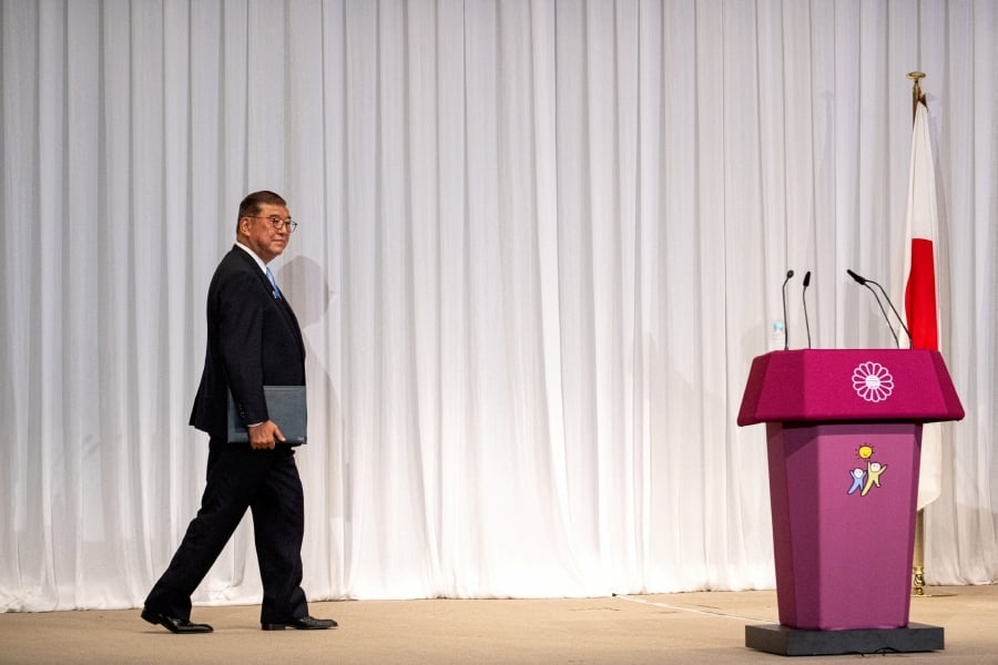 Japan PM Ishiba vows to stay on after bruising election defeat