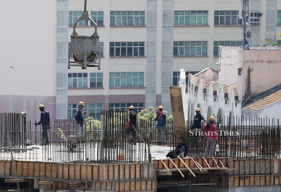 Guan Eng criticised for opposing minimum wage, EPF for migrants
