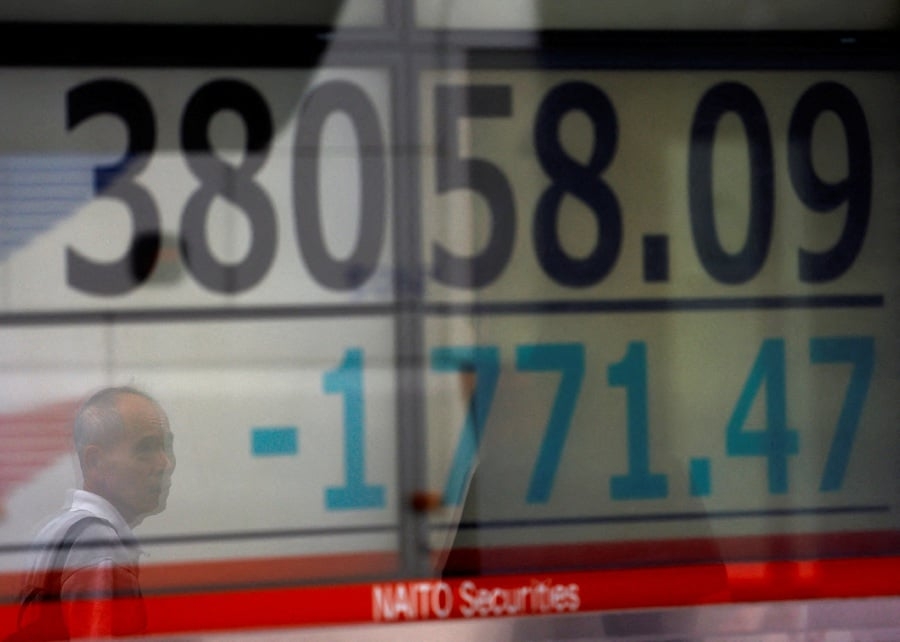 Japan's Nikkei rises on demand for futures, a weaker yen