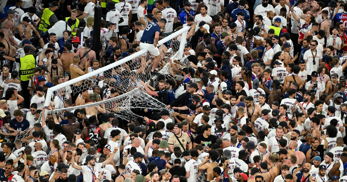 PSG fans invade pitch for souvenirs after Champions League triumph