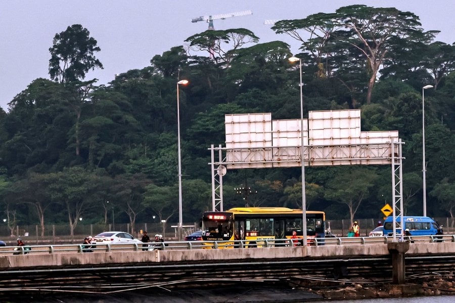Pay cut, extra trips caused strike among Singapore-bound bus drivers