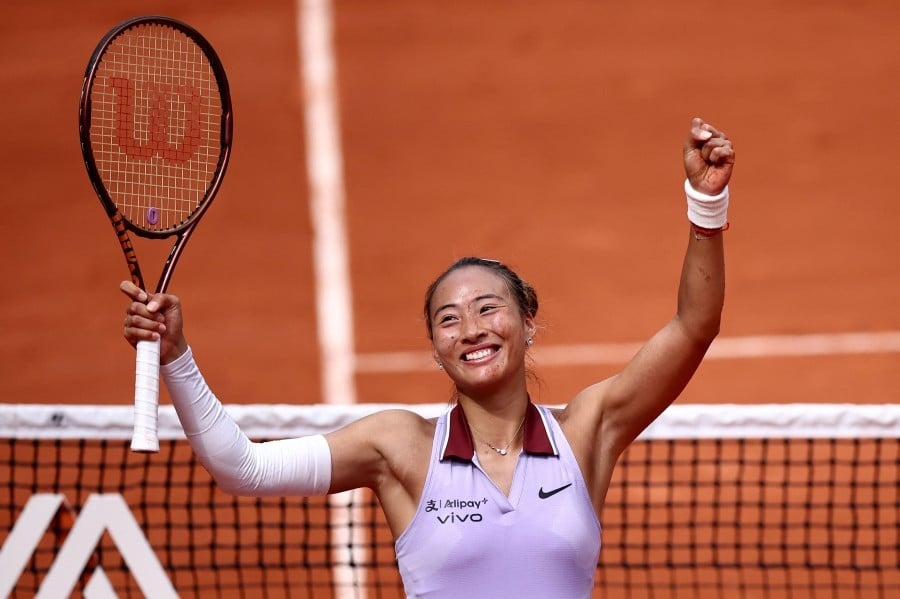 Olympic champion Zheng battles into French Open last eight