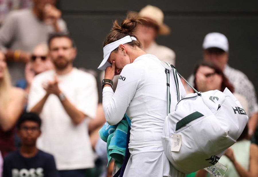 Wimbledon champion Krejcikova crashes out in tears, Sinner into last 16