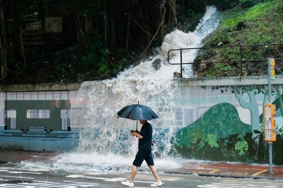 Hong Kong issues highest weather warning, as rains shut schools, courts and hospital wards