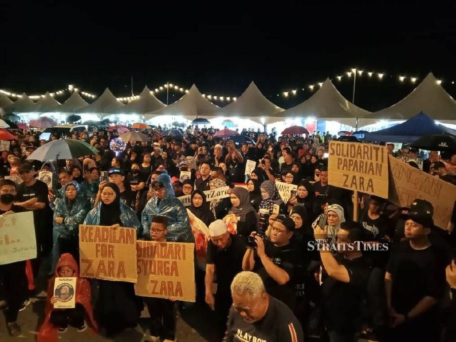 Thousands brave rain to attend solidarity rally for Zara Qairina