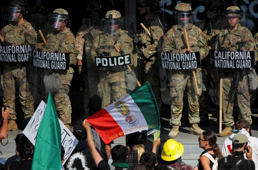 Unrest in Los Angeles over immigration raids as troops sent by Trump fan out