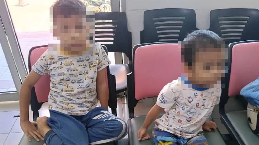 Police question five, including babysitter, after two boys found by roadside