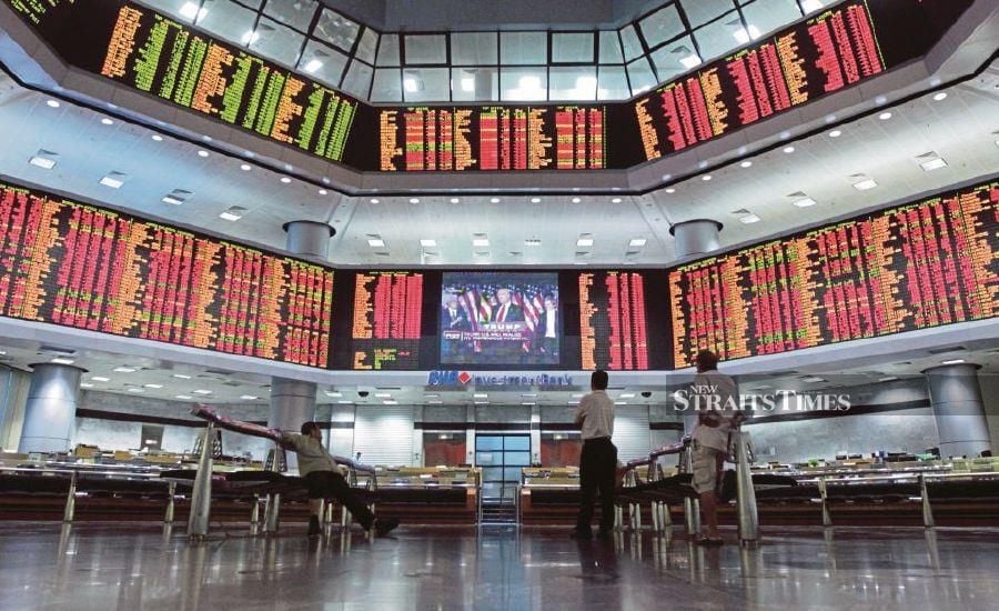 Bursa Malaysia down ahead of key US data releases