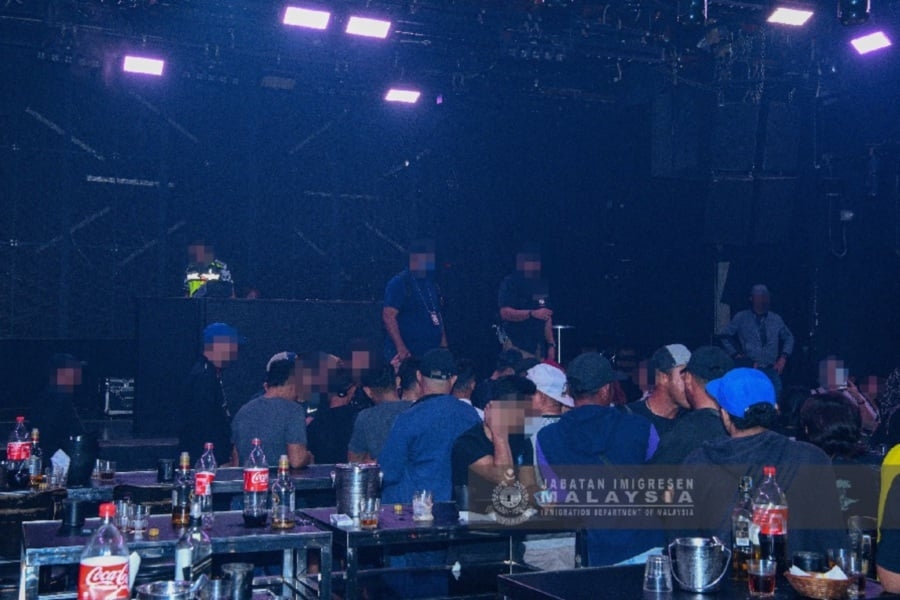Nearly 200 foreigners held in KL nightclub raid