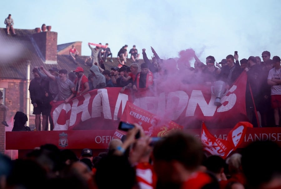 Liverpool fans celebrate historic title win at Anfield