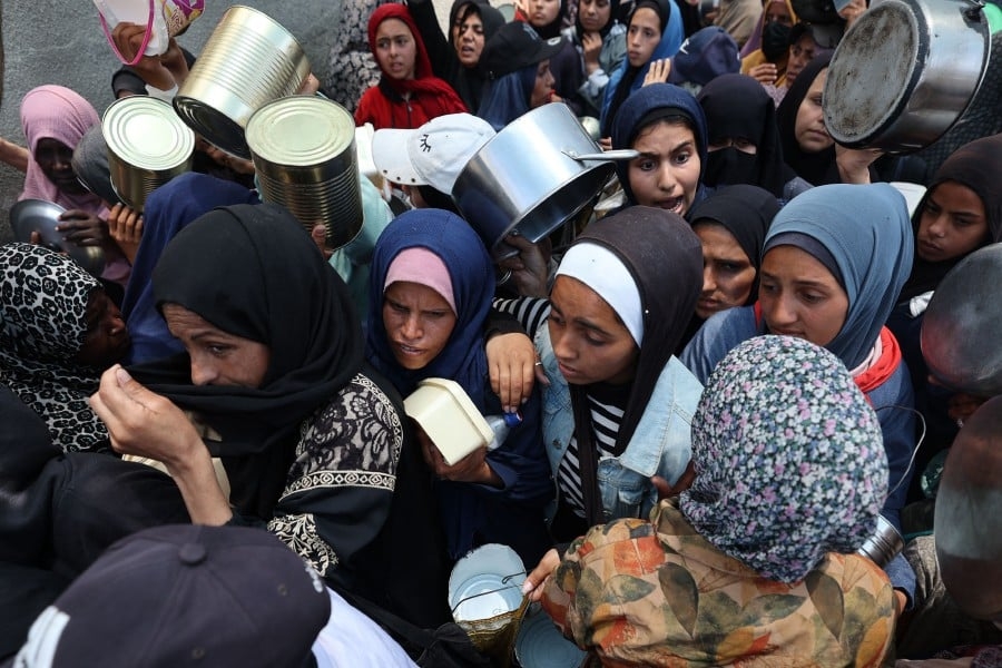 Gaza aid group halts operations as Israel declares roads combat zones