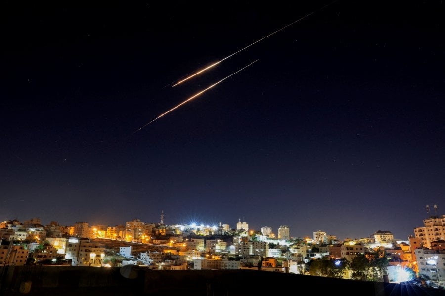 Syrians watch Iran-Israel crossfire as government stays silent