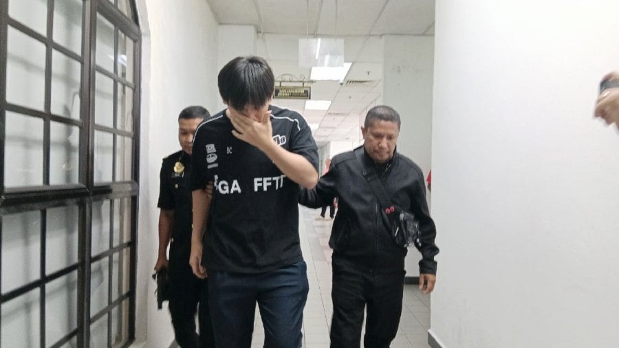 Kopitiam owner claims trial to bribery charge