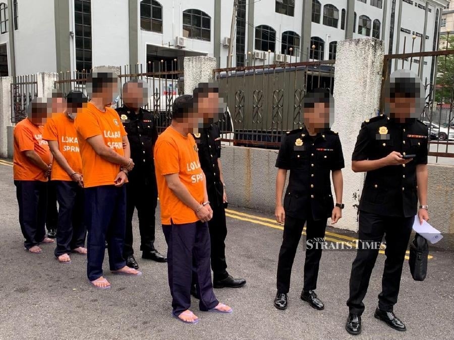 Four Malaysia– border enforcement officers remanded over 'flying passport' case