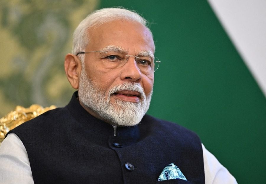 Modi's tax overhaul to strain finances but boost image amid US trade tensions