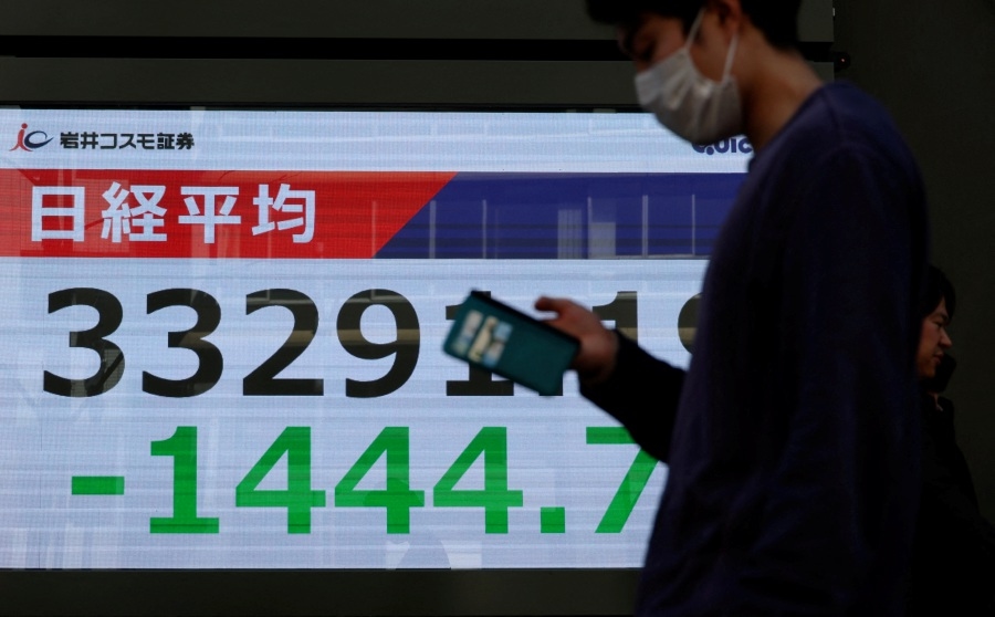 Japan's Nikkei inches down as election, tariff worries overshadow gains of chip-related shares