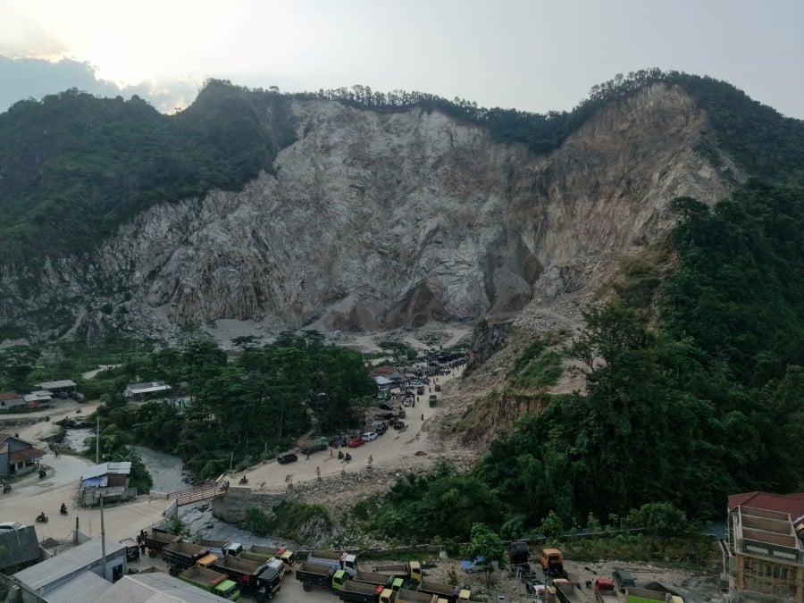 Indonesia quarry rockfall death toll rises to 18, seven still missing