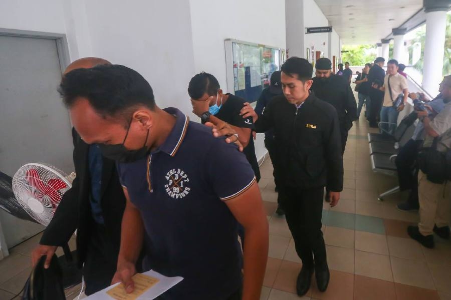 Two policemen, ex-cop claim trial to graft charges