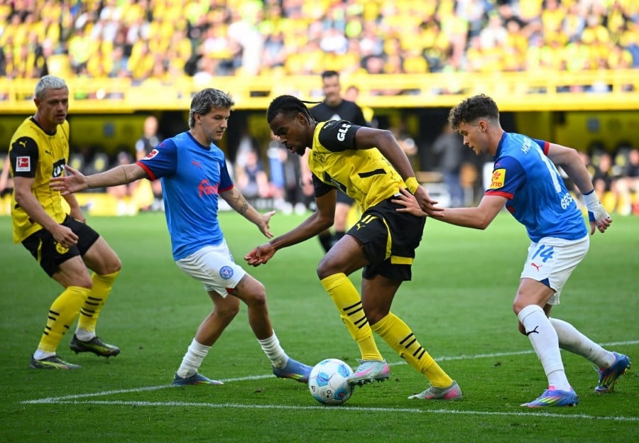 Dortmund complete escape act to snatch Champions League berth